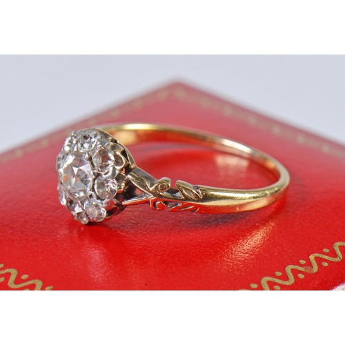 48 - A Ladies Diamond Cluster Ring set with a Central Stone & Eight Diamonds on a Pierced Open Work setti... 