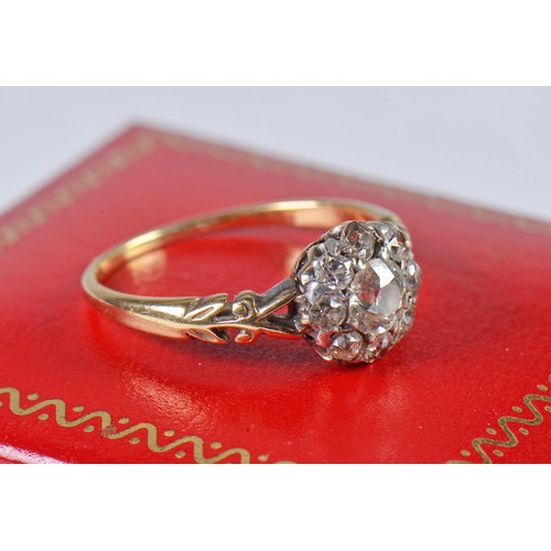 48 - A Ladies Diamond Cluster Ring set with a Central Stone & Eight Diamonds on a Pierced Open Work setti... 