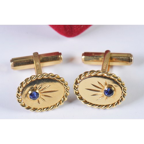 49 - A Heavy Pair of Gentleman's 18ct Gold Cufflinks each set with a Sapphire. Weighing: 14.5 grams.