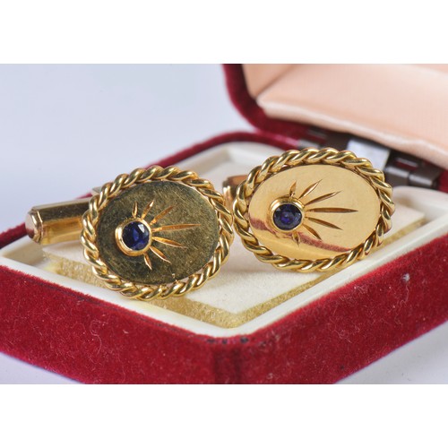 49 - A Heavy Pair of Gentleman's 18ct Gold Cufflinks each set with a Sapphire. Weighing: 14.5 grams.