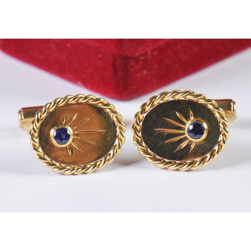 49 - A Heavy Pair of Gentleman's 18ct Gold Cufflinks each set with a Sapphire. Weighing: 14.5 grams.