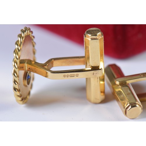 49 - A Heavy Pair of Gentleman's 18ct Gold Cufflinks each set with a Sapphire. Weighing: 14.5 grams.