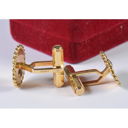 49 - A Heavy Pair of Gentleman's 18ct Gold Cufflinks each set with a Sapphire. Weighing: 14.5 grams.