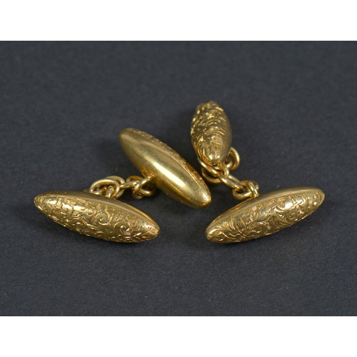 56 - A Pair of Victorian engraved 18ct Gold Torpedo Cufflinks. Weighing: 4.9 grams.