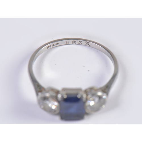 57 - A Ladies Sapphire & Diamond Dress Ring set with an Emerald Cut Dark Blue Sapphire & Two Diamonds. Si... 