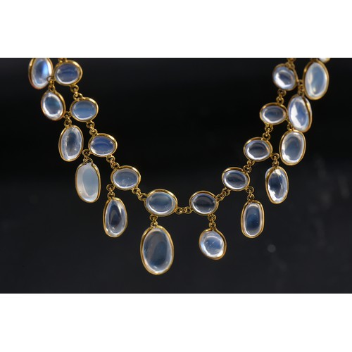 59 - An Arts & Crafts design Multi fringed tasseled Moonstone Necklace with clasp.