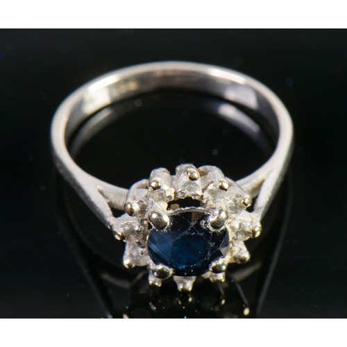 60 - A Ladies Sapphire & chip mounted Platinum set Dress Ring. Size: N. Weighing: 4.5 grams.