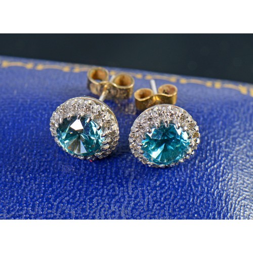 65 - A Pair of Pale Blue/Green Zircon & Diamond mounted Earrings in a Mappin & Webb Box.