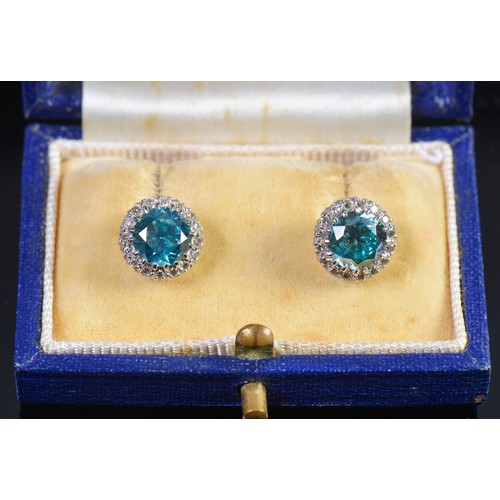 65 - A Pair of Pale Blue/Green Zircon & Diamond mounted Earrings in a Mappin & Webb Box.