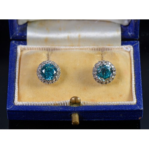 65 - A Pair of Pale Blue/Green Zircon & Diamond mounted Earrings in a Mappin & Webb Box.