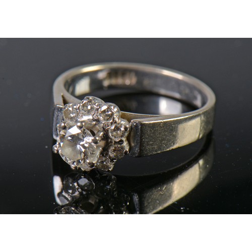 82 - A White Gold Diamond Cluster Ring set with a Central Stone & Nine Diamonds. Size: L. Weighing: 5.4 g... 