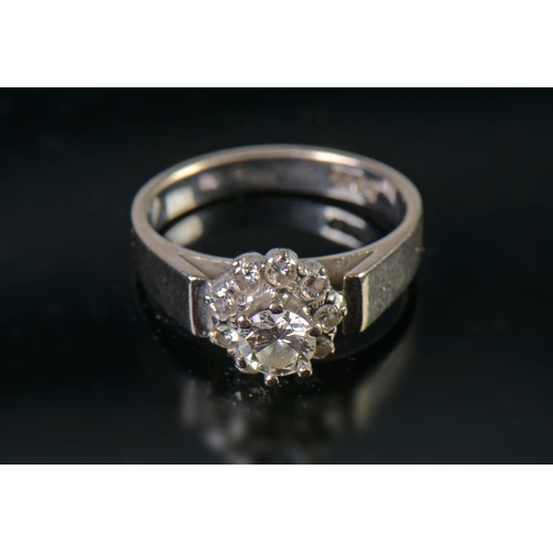 82 - A White Gold Diamond Cluster Ring set with a Central Stone & Nine Diamonds. Size: L. Weighing: 5.4 g... 