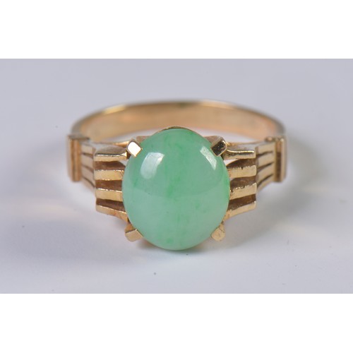 85 - A 1970s Jade set Ring with pierce & raised decoration. Weighing: 4.1 grams. Size: N.