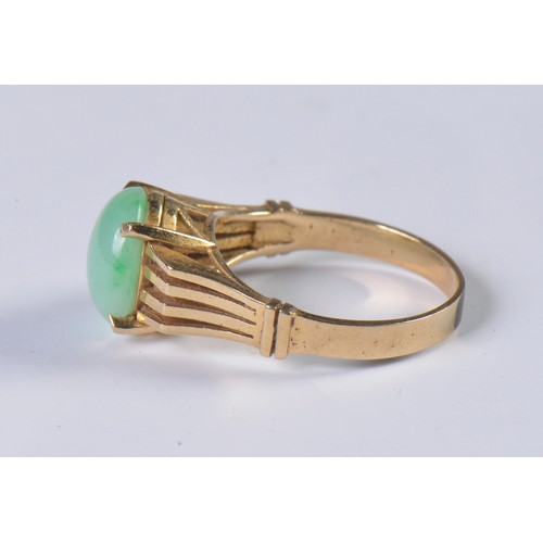 85 - A 1970s Jade set Ring with pierce & raised decoration. Weighing: 4.1 grams. Size: N.