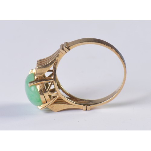 85 - A 1970s Jade set Ring with pierce & raised decoration. Weighing: 4.1 grams. Size: N.