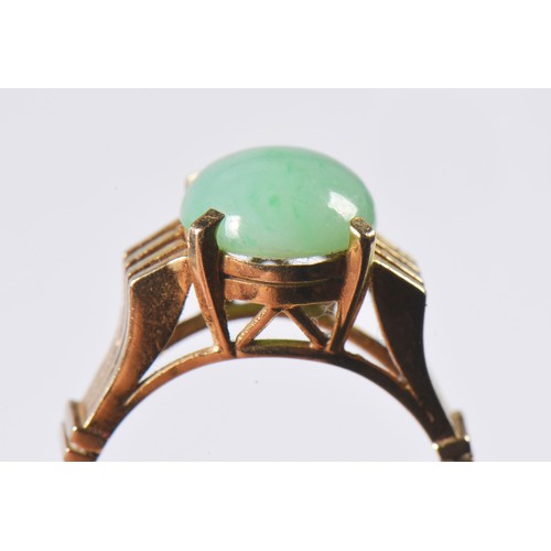 85 - A 1970s Jade set Ring with pierce & raised decoration. Weighing: 4.1 grams. Size: N.