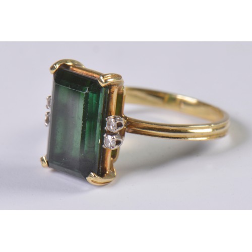 86 - An 18ct Gold Ring set with a Green 'Tourmaline' & Diamond Shoulders. Weighing: 3.9 grams. Size: N.