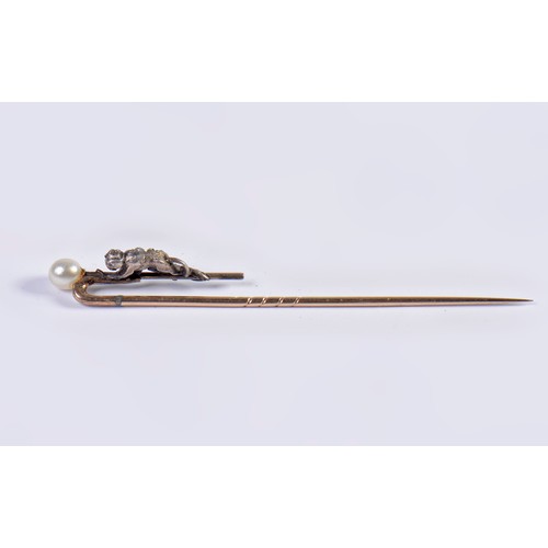 93 - A Monkey Diamond set Stick Pin mounted with a Pearl.