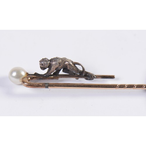 93 - A Monkey Diamond set Stick Pin mounted with a Pearl.