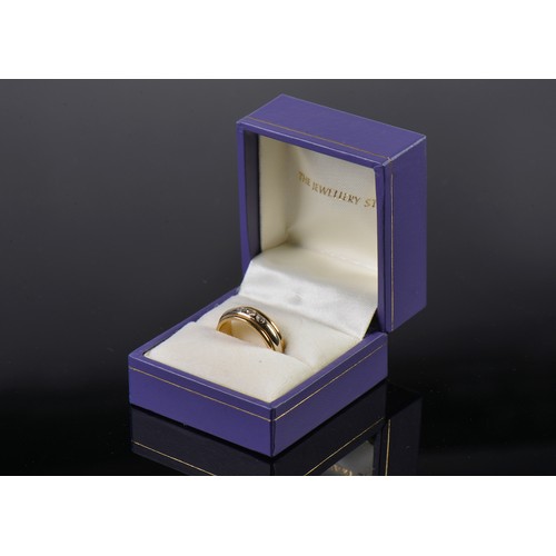 111 - A Ladies 18ct Gold Ribbed & Diamond set Two Tone Wedding Ring. Size: L. Weighing: 7 grams.