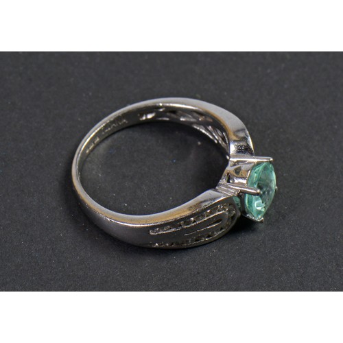 115 - An 18ct White Gold Diamond Set Paraiba Tourmaline weighing 1.25cts. Size: O Weighing: 5.43 grams.