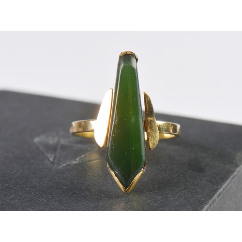 126 - A Modernistic Jade Set 18ct Gold Ring. Size: P. Weighing: 4 grams.