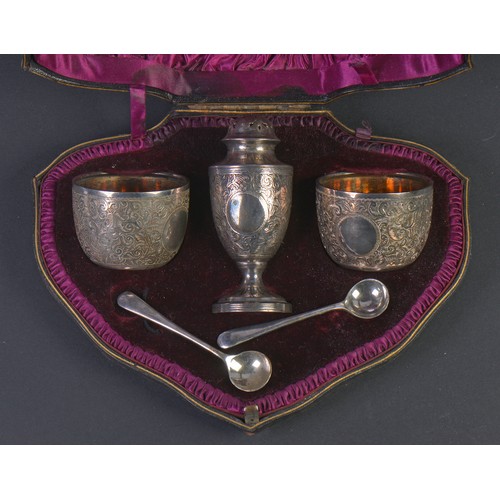 192 - A Three Piece Silver engraved Cruet Set in Case consisting of a Georgian Bun Top Castor, Two Small B... 