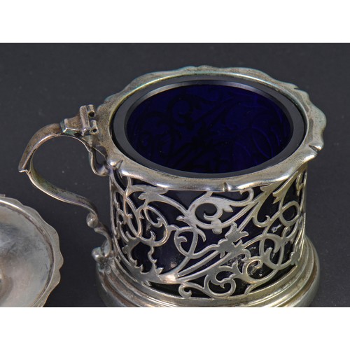 196 - A Silver pierced & Floral Mustard Pot with lid. Weighing: 121 grams. Sheffield N. Maker: Atkins Bros... 