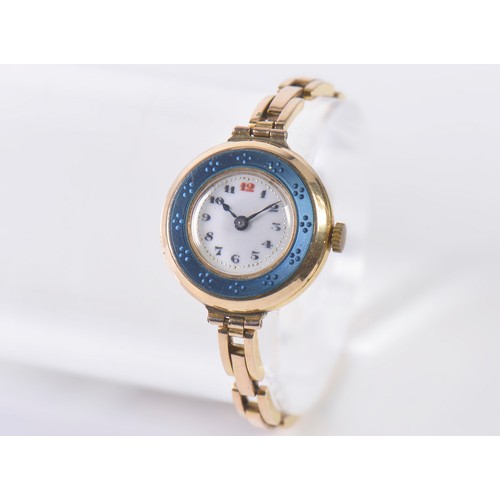 228 - A Vintage 15ct Gold Ladies Wristwatch with an Enamel Face & comes on a 15ct Gold Strap. Weighing: 23... 