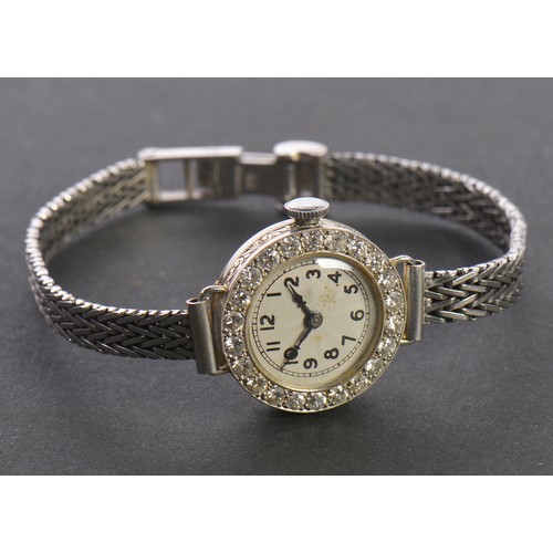 229 - A Ladies 9ct White Gold Cocktail Watch set with approximately 23 Diamonds. Weighing: 13.2 grams.