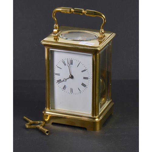 256 - A French Brass Four Plate Carriage Clock with visible escapement, Roman Numerals & Striking Complete... 