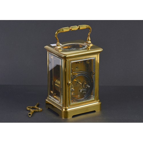 256 - A French Brass Four Plate Carriage Clock with visible escapement, Roman Numerals & Striking Complete... 