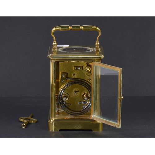 256 - A French Brass Four Plate Carriage Clock with visible escapement, Roman Numerals & Striking Complete... 