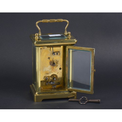 257 - A French Brass cased Four Plate Carriage Clock enamelled face & Key.