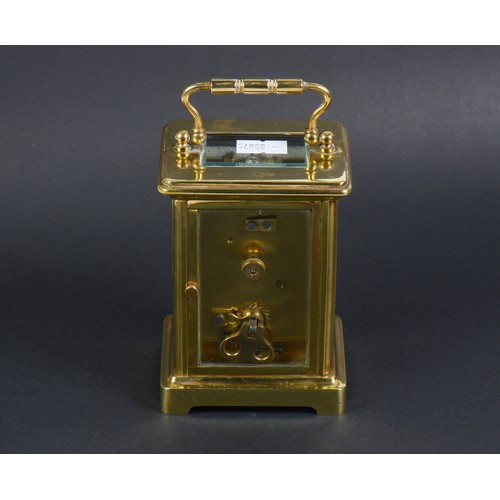 258 - A French Brass cased Four Plate Carriage Clock enamelled face.