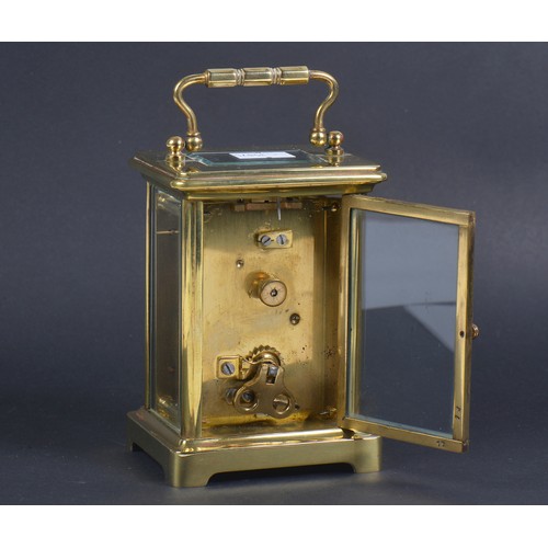 258 - A French Brass cased Four Plate Carriage Clock enamelled face.