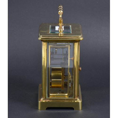 258 - A French Brass cased Four Plate Carriage Clock enamelled face.