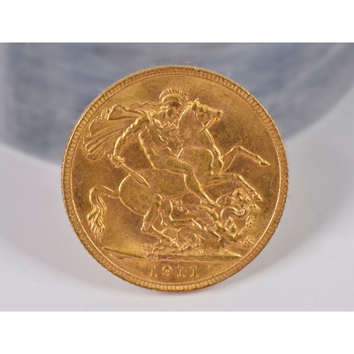 222A - A 1911 George V Gold Sovereign. Marked B.P.