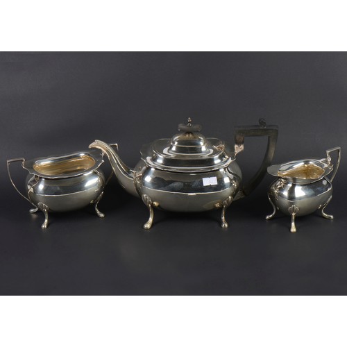 15 - A Three Piece Georgian design Silver Tea Set with a Chippendale Border & resting on Pad Feet. Sheffi... 