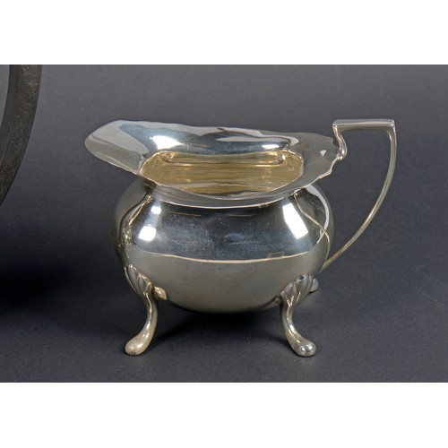 15 - A Three Piece Georgian design Silver Tea Set with a Chippendale Border & resting on Pad Feet. Sheffi... 