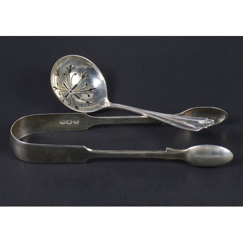 17 - A Pair of Silver Sugar Tongs, a Sifter Spoon & Three Tea Spoons. Weighing: 123 Grams.