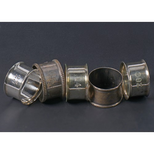 25 - Two Silver Napkin Rings. Weighing: 69 Grams. Along with Three Silver Plated Napkin Rings.