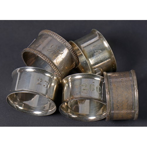 25 - Two Silver Napkin Rings. Weighing: 69 Grams. Along with Three Silver Plated Napkin Rings.