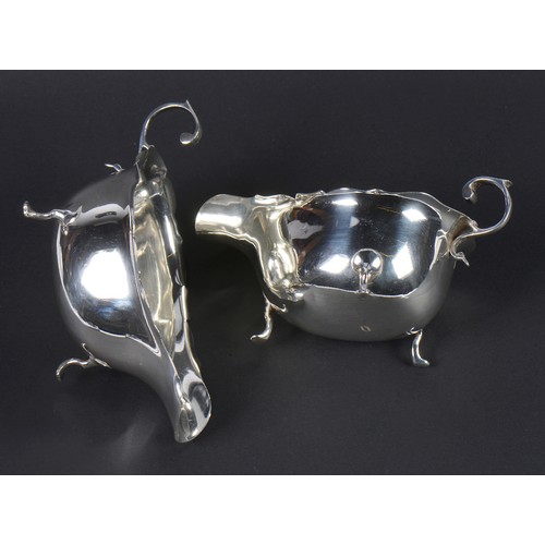 32 - A Pair of Silver Chippendale bordered & Scroll over handled Sauce Boats. Birmingham I. Weighing: 178... 