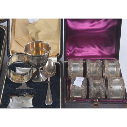 35 - A Silver Christening Set in Case, 6 x Silver Plated Napkin Rings in Case & a Set of Knives in Case.