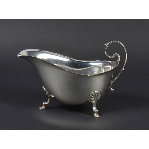 56 - A Silver Scroll bordered Sauce Boat. Weighing: 79 grams.