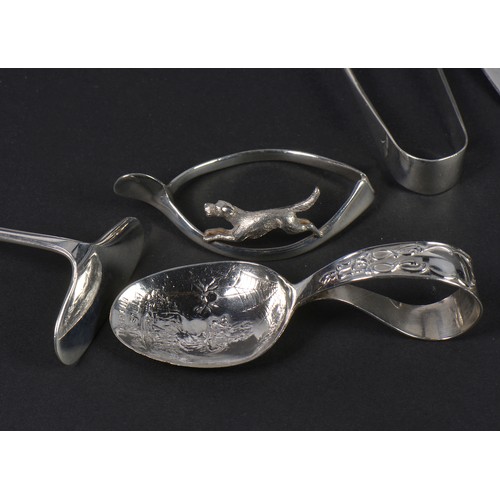 63 - A Silver Napkin Ring, Wishbone with a Fox, Sifter Spoon, Butter Knife, etc. Total Weight: 100 grams.