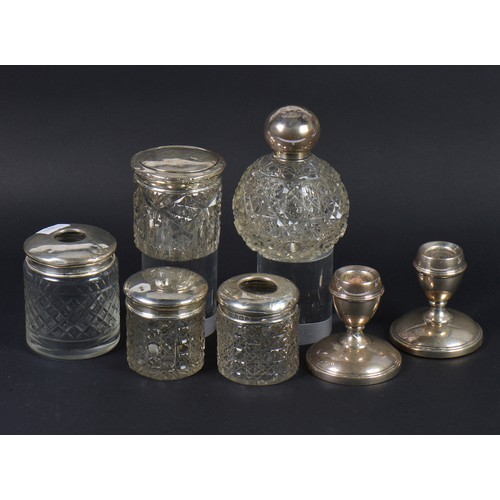 65 - A Silver Topped Cologne Bottle, Silver Topped Bottles, Dressing Table Candlestick, etc.