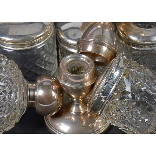 65 - A Silver Topped Cologne Bottle, Silver Topped Bottles, Dressing Table Candlestick, etc.