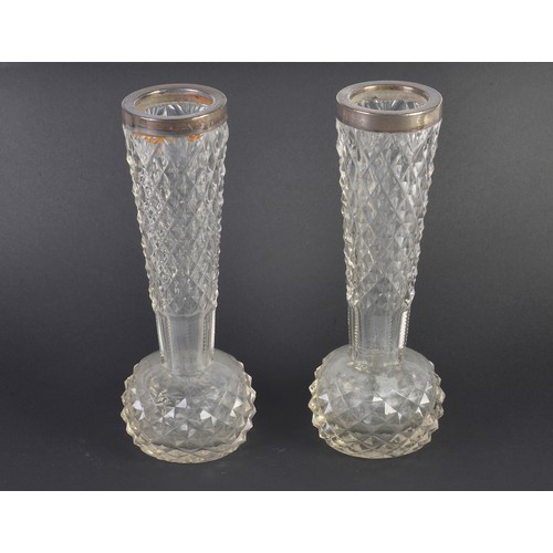 84 - A Pair of Silver mounted Cut Glass Specimen Vases with Diamond Point Cutting. Measuring: 23cms high.